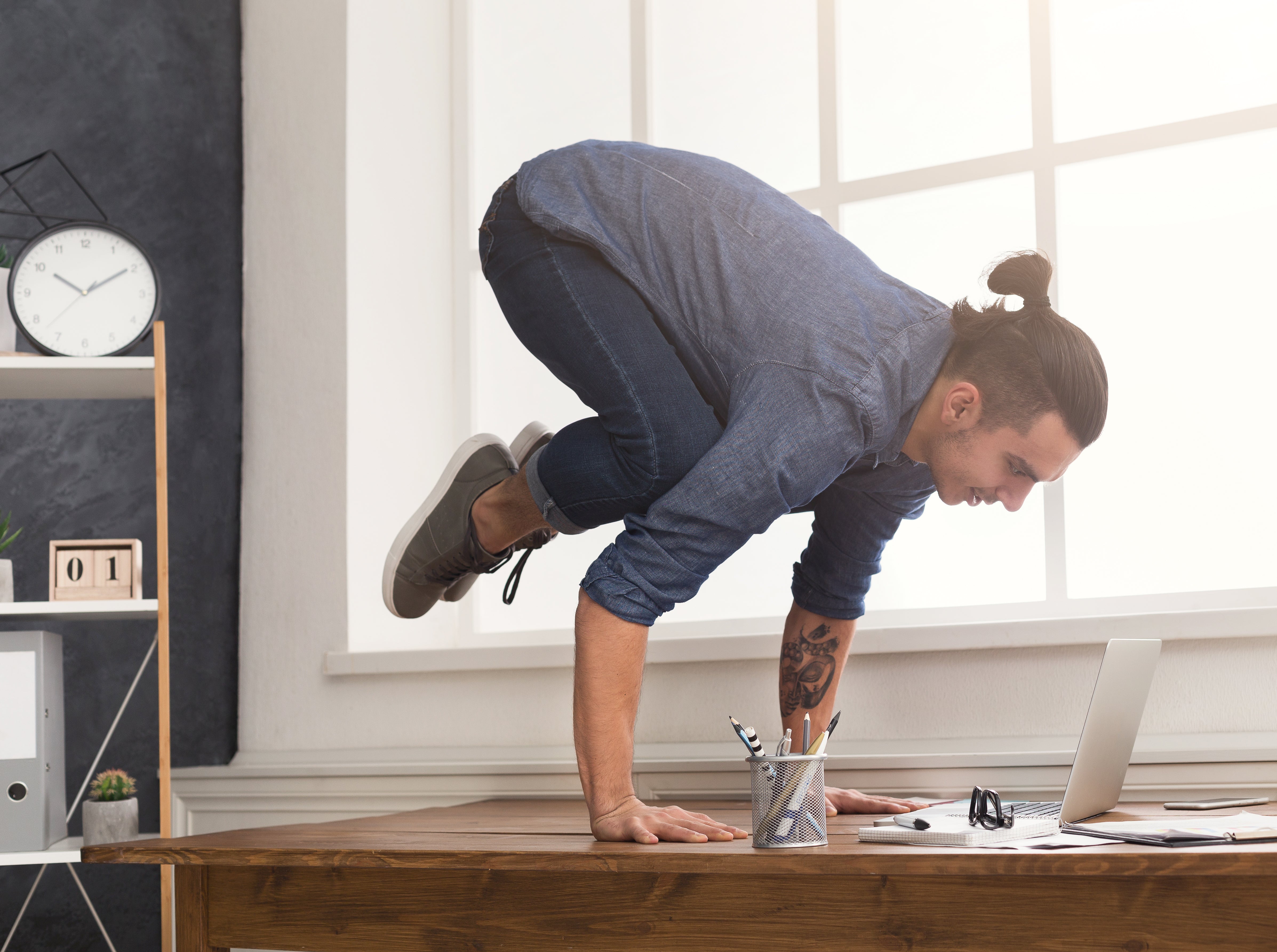 Not moving enough in your work day? Try desk yoga!